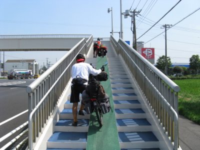 Walking the bikes over a busy road.