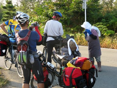 Taking time to talk with a local elder. There were a lot of steep rolling hills at days end.