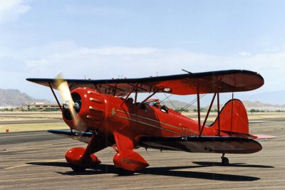 Red Biplane over Red Mountain