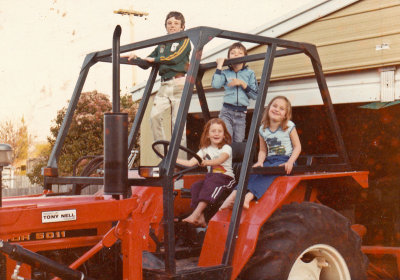 Driving tractor with her cousins