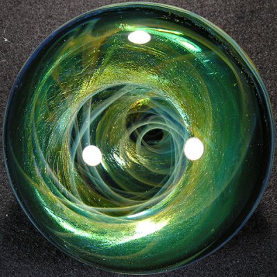This one begs to be seen in hand.  Wonderful depth to the vortex, and oh so shiny emerald green!
