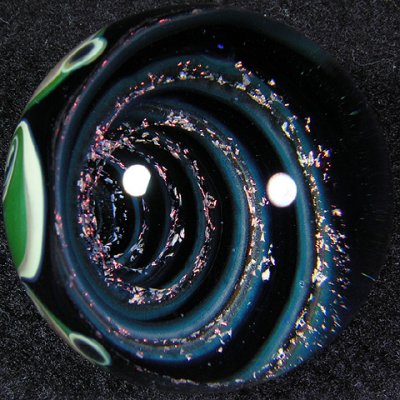 Beautiful vortex, awesome backside - you won't know which side of this little jewel to display!
