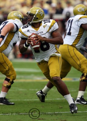 Yellow Jackets QB Calvin Booker rolls left and looks for a receiver downfield