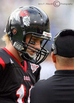 Bulldogs QB Campbell goes over strategy with an offensive coach