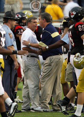 Jackets Head Coach Paul Johnson meets at midfield after the game with Gardner-Webb Head Coach Steve Patton