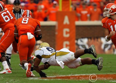 Georgia Tech DE Morgan dives in an attempt to trip up Clemson RB Harper