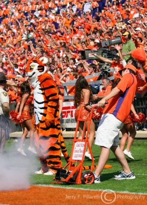 Clemson mascot The Tiger stands by as the cannon is fired after a score