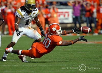 Tech DE Burnett reacts as Clemson WR Aaron Kelly laterals to a teammate after a catch late in the game