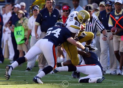 Tech B-back Dwyer is hit by Virginia LB Jon Cooper as he tries to head up the sidelines