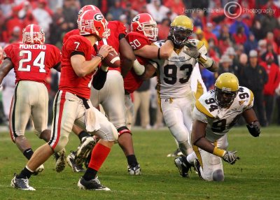 Yellow Jackets DE Michael Johnson and DT Anyaibe rush Bulldogs QB Stafford