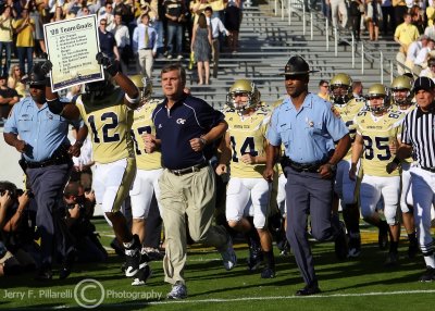 Georgia Tech Yellow Jackets Head Coach Paul Johnson leads his number 10 team onto Grant Field