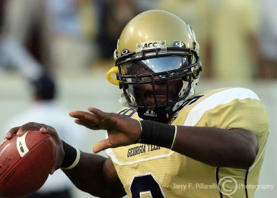 Jackets QB Josh Nesbitt warms up before kickoff