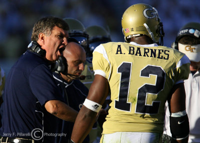 Georgia Tech Yellow Jackets Head Coach Paul Johnson makes a point to LB Anthony Barnes