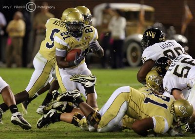 Georgia Tech B-back Dwyer hits the hole created by his offensive line
