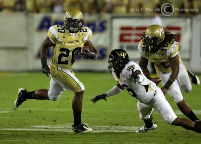 Jackets A-back Roddy Jones uses a block by teammate Allen to get outside