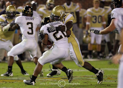 Yellow Jackets LB Sedric Griffin stops Demon Deacons RB Pendergrass in the secondary
