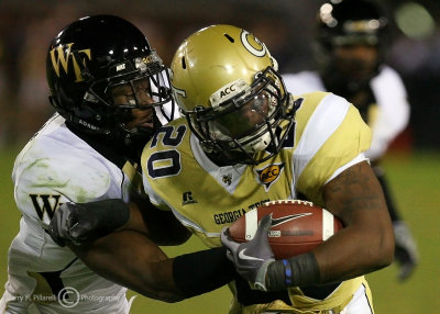 Georgia Tech A-back Jones is caught by Wake Forest SS Quarles after a short gain