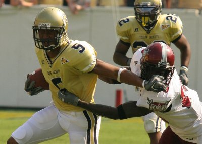 WR Greg Smith attempts to break a tackle