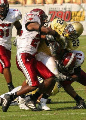 RB Tashard Choice is wrapped up by the Troy defense