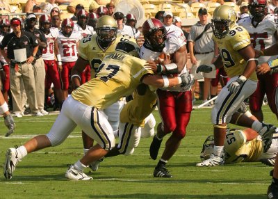LB Matt Braman corrals a Troy RB