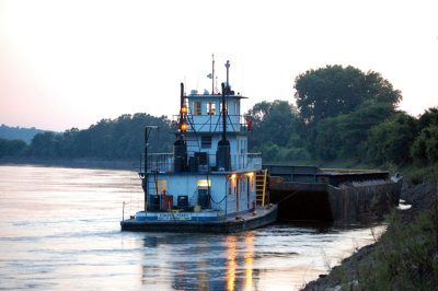 Based out of the port of Memphis, Tennessee. Here I caught some river rats pushing a barge up the Mighty Mo. This boat must have been taking a break. In the full size version, you can clearly see some dude in the sheel house working on a computer.