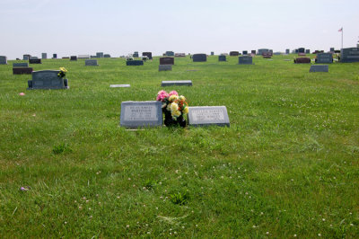 There are three people buried here; Clellen Kimsey, his wife, Nellie Lee [Pardieu] Kimsey, and their daughter, Hellen Bernice [Kimsey] Martinson. I took this shot to show where the stone is located within the cemetery. Here you can clearly see the flagpole, top right of the photograph. 