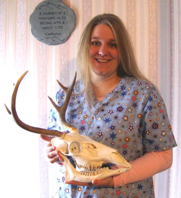 My girl smiling with her buck skull. How many guys can say that about their wives? Mine is the coolest.