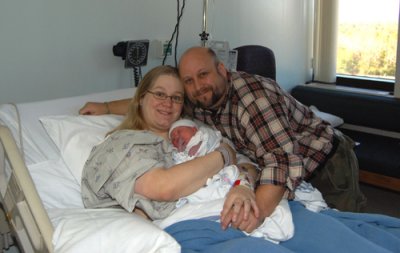 Isaac Mann with his parents, just about two hours after birth. 