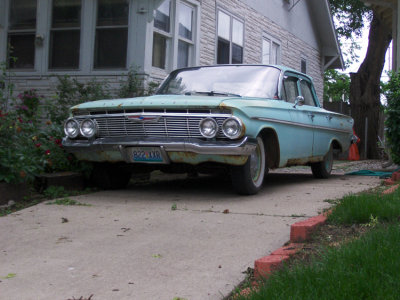 This car sits in a driveway, about a block from our bank. One day I'll stop and take more pictures.