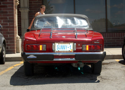 This poor woman couldn't figure out just what it was I thought I was doing, wandering around a parking lot taking pictures of an old foreign ragtop. The flash refected the license plate but sans flash, it was too dark for my tastes.