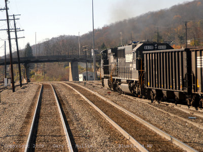 A hopper train leaving as seen from the last car.jpg