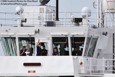 The USCGC BERTHOLF's Commanding Officer, CAPT Patrick Stadt, waving as they transit thru Government Cut, photo #1963