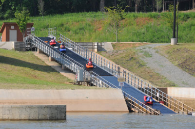 Kayakers riding the conveyor back to the top
