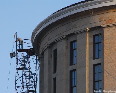 Workers bringing up buckets to the top of the Ohio Statehouse Rotunda