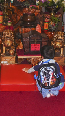 Child studies altar