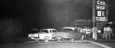 1950's - a 1956 Studebaker Hawk in a minor car wreck in front of the Car Hop Drive-In featuring Teleburgers and Teleshakes