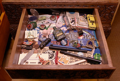 9 
Every home has a place to store those small useless trinkets we've collected over the years. Objects that hold memories of people, places and times gone by. Some people keep them in shoe boxes, old suitcases or trunks and some keep them in a little designated junk drawer. This is mine. These are my memories.