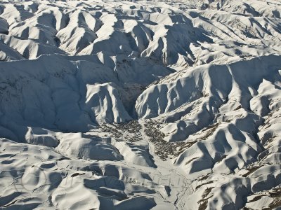 Village in the Afghan snow covered mountains