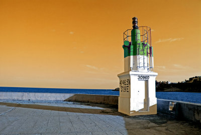 Lighthouse illuminated by the sky...