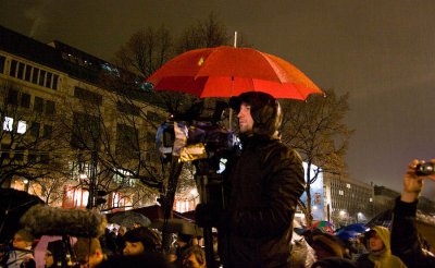 Cameraman with umbrella