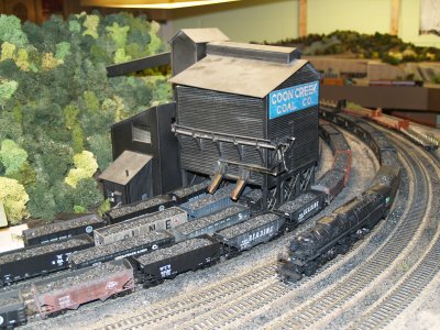 A C&O Allegheny passes the Coon Creek Coal Tipple with anoher string of loaded coal, while four more sit waiting to be arranged.