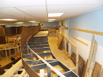 View from landing of stairs to main living area looking towards far wall of basement.