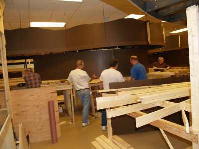 Installing the masonite backdrop on the lower level.
