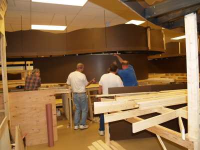 Installing the masonite backdrop on the lower level.
