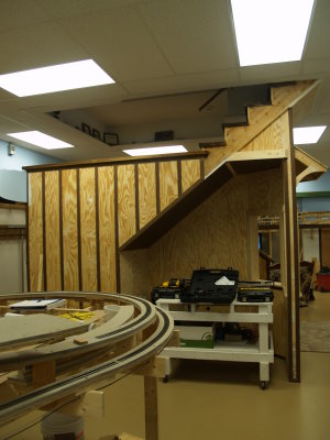 The steps up to the main living area, with masonite applied to give the appearanc eof board and batten siding.