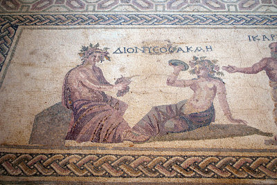 Pafos Archaeological Site Mosaic Dionysos brings wine to Ikarios