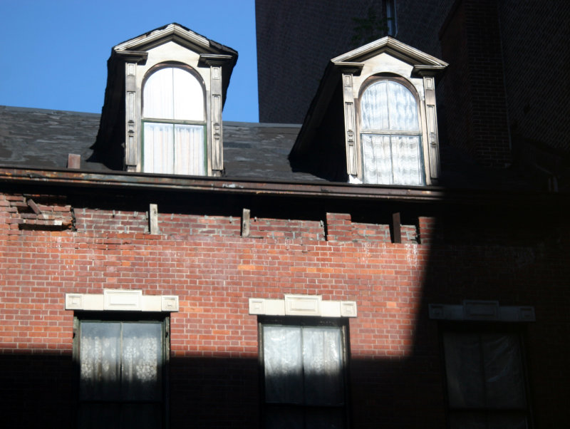 Window Reflection - Rising Sun on Two Gables