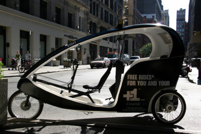 Empty Pedicab with Washington Place in the Background