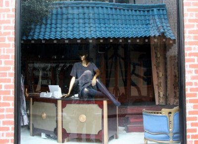 Fashion Window with Japanese Restaurant Reflection