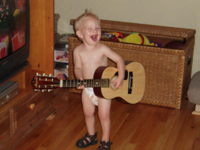 Conner playing the guitar